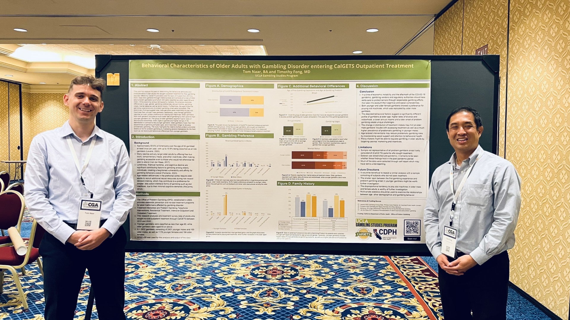 Dr. Timothy Fong and Tom Naar show off their poster presentation for the Poster Lightning Talks at the 26th Annual ICRG Conference on Gambling and Addiction